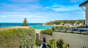 a view of the ocean from a house at Stoneferry- A Beachfront Beauty - Free Wifi in Port Elliot
