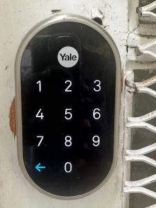 a black remote control attached to a wall at Roomy Oasis DC area pet friendly in Takoma Park