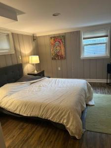 a bedroom with a large bed and a window at Roomy Oasis DC area pet friendly in Takoma Park