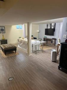 a living room with a couch and a table at Roomy Oasis DC area pet friendly in Takoma Park