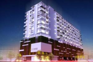 a tall white building with a lot of windows at COASTAL COCOON STUDIO in Negombo