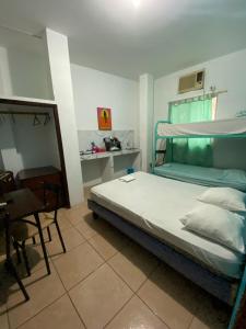 En eller flere senger på et rom på Playa Malecón, suites y Apart’s