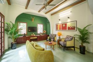 a living room with a couch and chairs and a tv at House of Comfort - 3 BR & 3 baths - 1' to Hoan Kiem Lake & Old Quarter in Hanoi