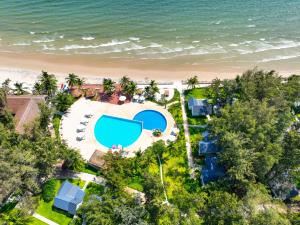 an aerial view of a resort with a swimming pool and the beach at Palace Long Hai Resort & Spa in Long Hai