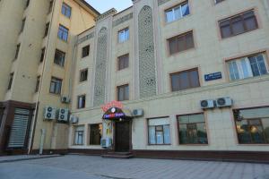 a building with a sign on the front of it at TINY ART HOUSE HOTEL near Airport of Samarkand in Samarkand