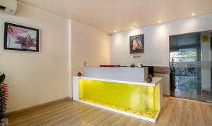 a yellow and white counter in a room at Treebo Trend Cabana in New Delhi