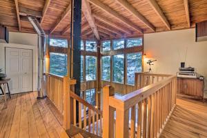 a room with a wooden staircase in a house at Swanhouse. Waterfront home. in Seldovia