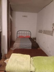 Ein Bett oder Betten in einem Zimmer der Unterkunft Casa 27