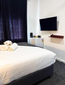 Manjimup Hotel客房内的一张或多张床位