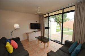 a living room with a couch and a tv at Riverview Holiday Apartment 78 - Kalbarri WA in Kalbarri