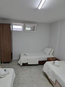Postel nebo postele na pokoji v ubytování NEZİH SUİTS OTEL