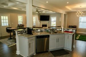 a kitchen with a sink and a counter top at Come enjoy this modern, luxury oasis! 15 mins from downtown and the airport in Atlanta