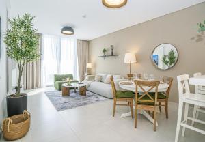 a living room with a couch and a table at HomesGetaway-2BR Apt in Al Wasl 1 Residences in Dubai