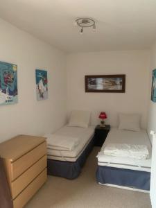 Un pat sau paturi într-o cameră la Le Portillo