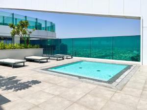 a swimming pool on the side of a building at HomesGetaway-2BR Apt in Al Wasl 1 Residences in Dubai