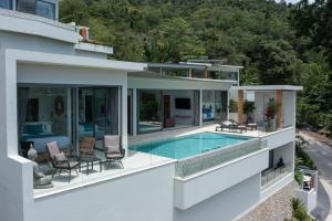an image of a house with a swimming pool at Zog Villas in Mae Nam