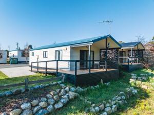 a mobile home with a porch and a deck at BIG4 St Helens Holiday Park in St Helens