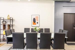 a dining room with a table and chairs at Group-Friendly 6BR Luxury Suite in Prime South Loop Location with Optional Parking and Gym Access Near McCormick Place, Soldier Field and Grant Park in Chicago