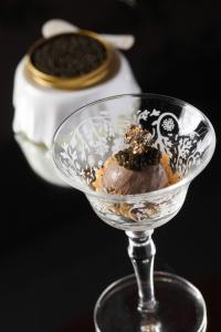 a dessert in a glass bowl on a table at Lan Kwai Fong Hotel - Kau U Fong in Hong Kong