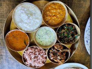 a plate of different types of food on a table at HILL PARADIZÈ couple friendly in Mussoorie