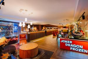 a restaurant with a joker dragon prepared sign and a counter at Vespia Hotel in Istanbul