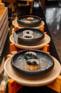 a row of plates with food on them on a table at Vespia Hotel in Istanbul