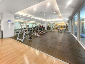 a gym with treadmills and machines in a room at Lush Interior Brand New 1BDR-Heart of Downtown in Dubai