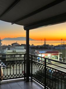 a view of the sunset from a balcony at ZEN Apartments in Alexandroupoli