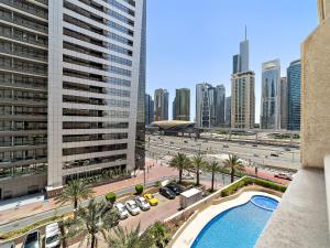 a view of a city from a building with a pool at Brand New 1BDR Dubai Marina -Close to Metro in Dubai