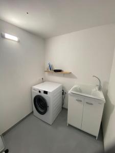 a laundry room with a washing machine and a sink at Exclusive house in Marostica in Marostica
