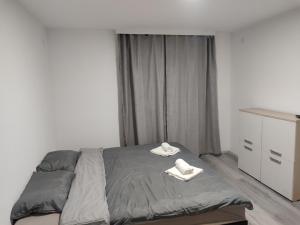 Postel nebo postele na pokoji v ubytování Apartmani Hub