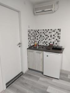 Kuchyň nebo kuchyňský kout v ubytování Apartmani Hub