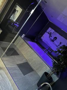 an overhead view of a room with purple lighting at Secret Cabin Getaway in Hartlepool +5 photos