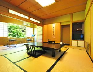 a large room with a ping pong table in it at Ryokan Imai in Shibata