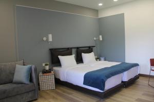Letto o letti in una camera di Hover Boutique Hotel
