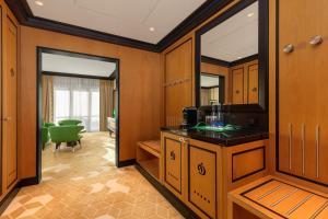 a bathroom with a sink and a mirror at Dinamo Hotel Baku in Baku