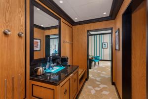 a bathroom with a sink and a mirror at Dinamo Hotel Baku in Baku