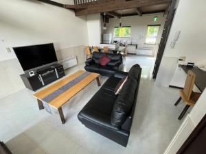 TV a/nebo společenská místnost v ubytování Chalet Fuyuri