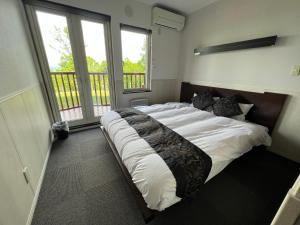 Postel nebo postele na pokoji v ubytování Chalet Fuyuri