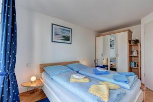 Ein Bett oder Betten in einem Zimmer der Unterkunft Villa Seeschloss