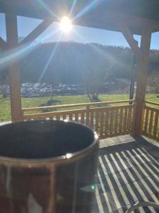 a barrel on a deck with a view of a mountain at Kasi Polany in Krempna