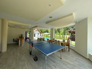 an empty room with a ping pong table in it at Családi Villa in Balatonszemes