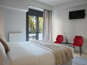 Ένα ή περισσότερα κρεβάτια σε δωμάτιο στο Athens Project Luxury Apartments