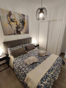 a bedroom with a bed with two towels on it at Nueva Casa with Private POOL in Puerto Marino