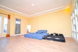 a bedroom with two beds in a room at Villa WS by Masterpiecevilla in Batu