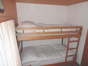 a couple of bunk beds in a room at Ferienhaus in Quinten-Au in Quinten