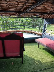 a room with a bench and a trampoline at Lakenest overnight in Alleppey