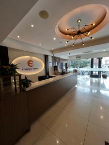 a lobby of a hotel with a reception counter at Hotel Economy Kapar in Kapar