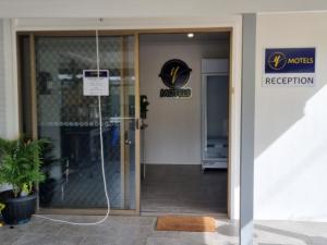 an entrance to a mordons office with the door open at Y Motels Yarraman in Yarraman
