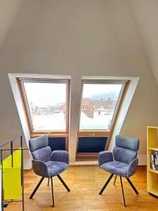 Ein Sitzbereich in der Unterkunft Moderne Apartments in attraktivem Altbau